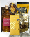 kadoo cocktail holiiday curated gift box with eleven madison home vermouth, fruition brown butter milk chocolate, pretzel, bear food peanut, chocolate orange slice and more,