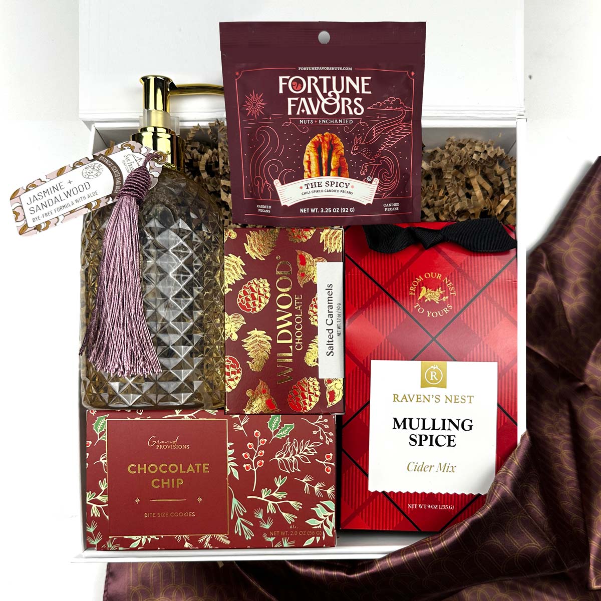 Gift Box with mulling spice cider miix, wildwood chocolate, bottle of hand soap, chocolate chip and other treats.