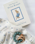 peter rabbit book by beatrix potter, silicone wood blue teether, white swaddle
