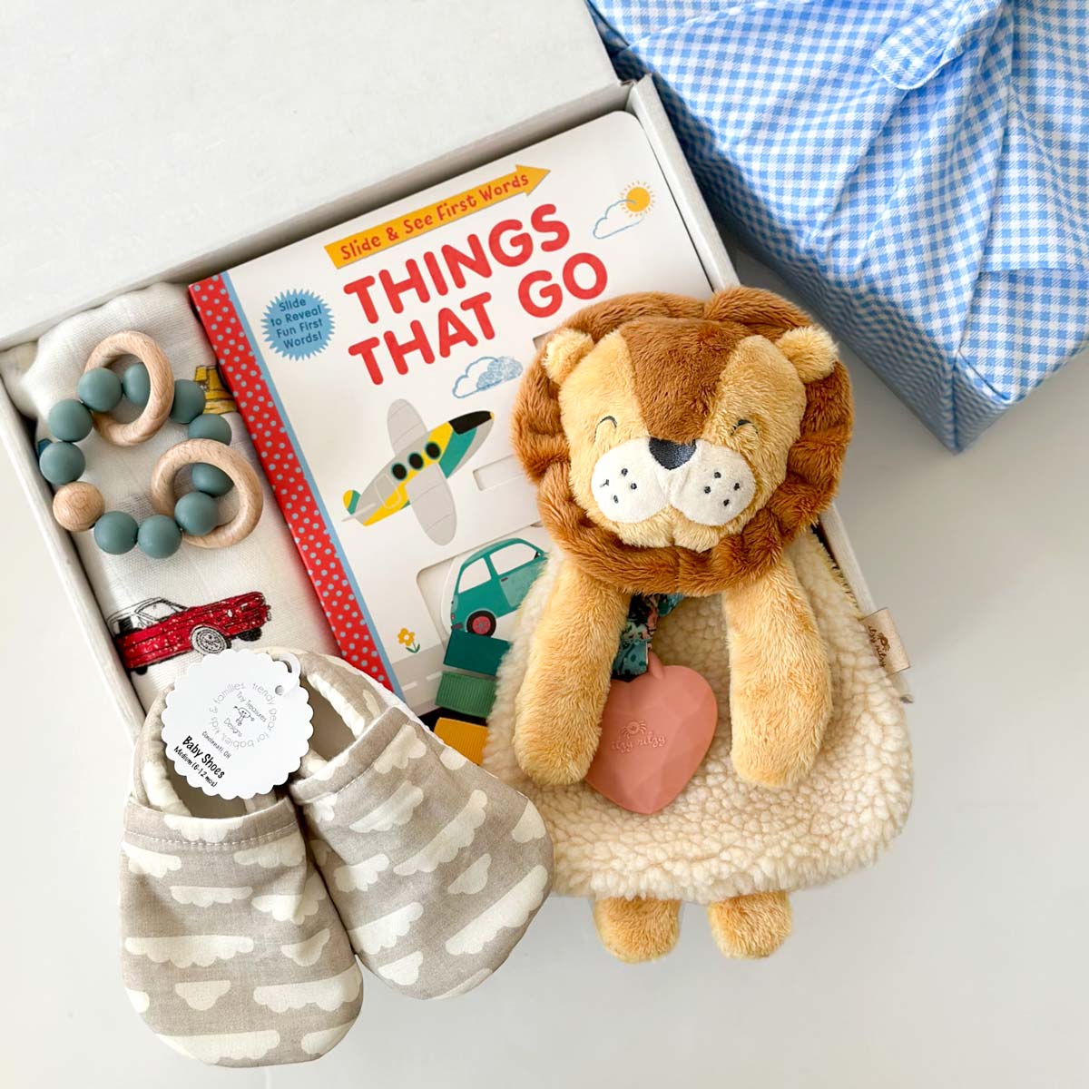 kadoo baby boy gifts things that go, include board book, lion plush, baby shoes, swaddle, teether &amp; more.
