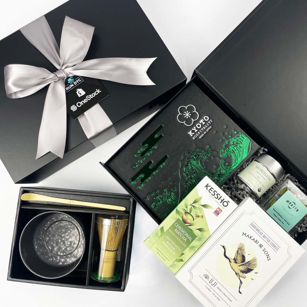 Tea set with packaging and a branded box on a white background