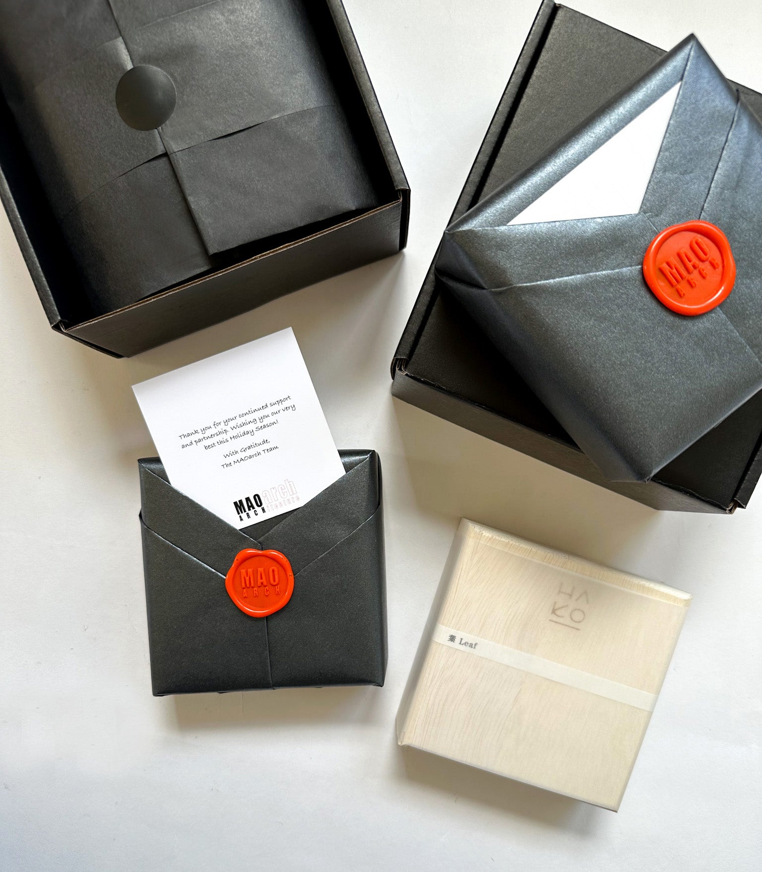 Corporate gift for MAO Arch. Gifts are wrapped in black origami paper with custom red wax seal. HAKO incense woodbox.