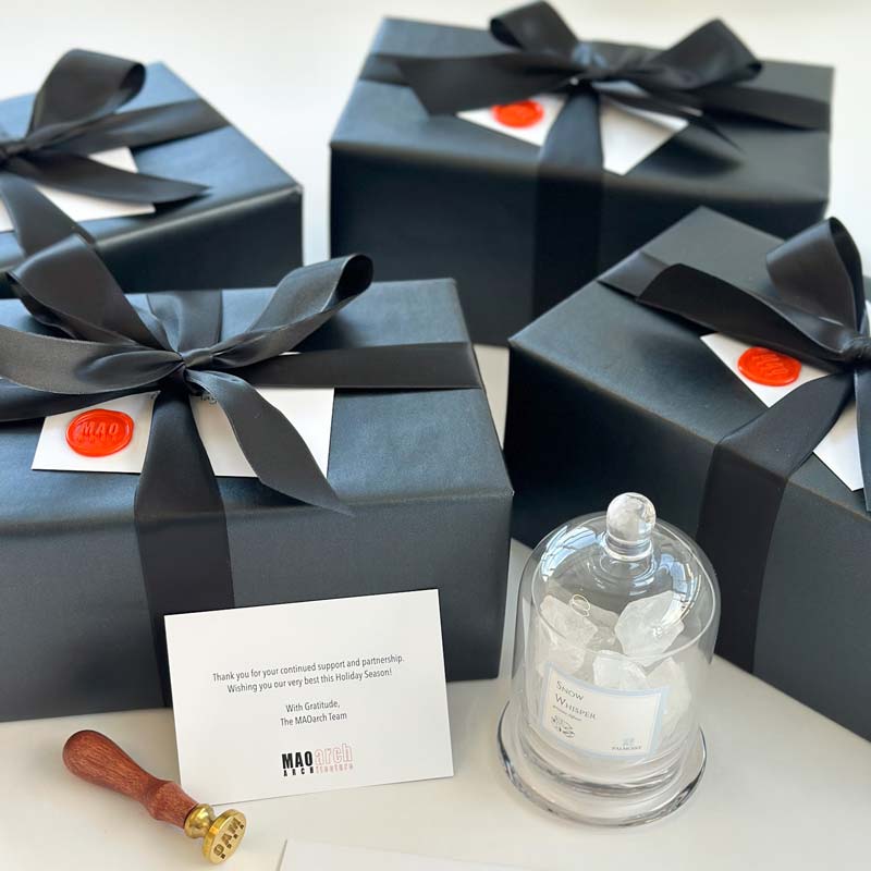 Custom corporate gift box for MAOarch Architecture. Gifts included room diffuser, custom wax seal and more.