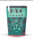 A stand-up pouch package for NYC New York City Taffy, featuring a stylized teal and dark gray Statue of Liberty design with the words 'NYC NEW YORK CITY TAFFY' on a white background.