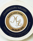 A round cheese spread package lid or top label for Mille Lacs Foods Chardonnay Havarti, with a cream outer ring, dark navy blue band, and tan center featuring the stylized 'ML' logo and product text.