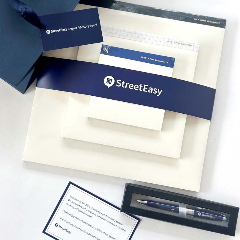 Custom corporate swag bag for StreetEasy. Gifts included branded planner, branded pen and more