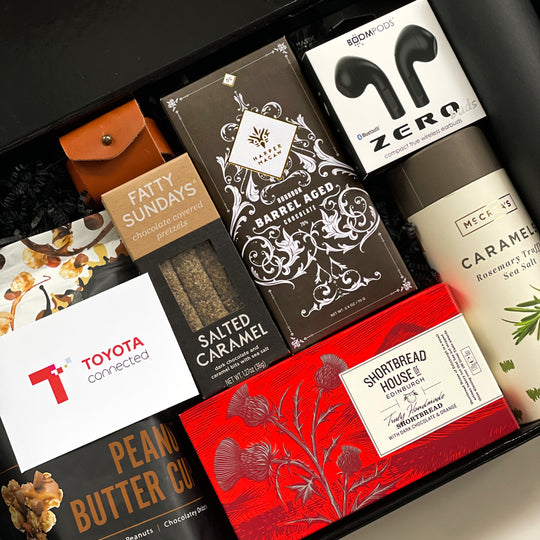 Toyota Employee Appreciation Gifts with chocolate, cookies, bluetooth headset, caramels, popcorn, airpod leather case, pretzel and more.