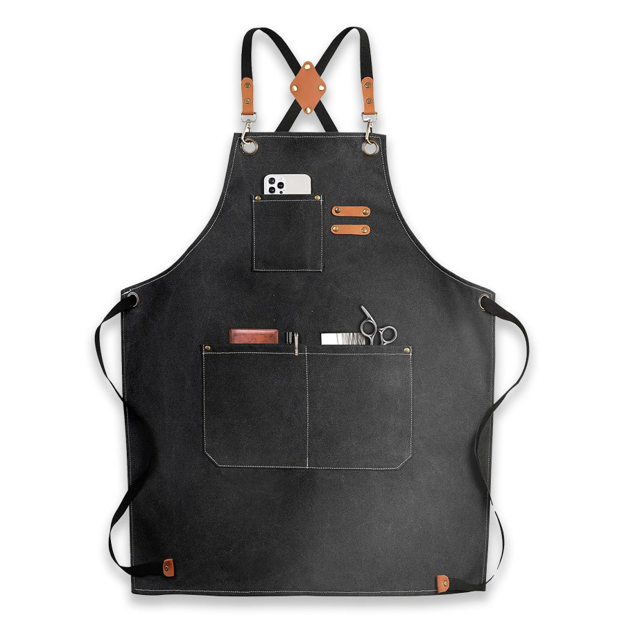 Black canvas apron with leather straps and pockets.