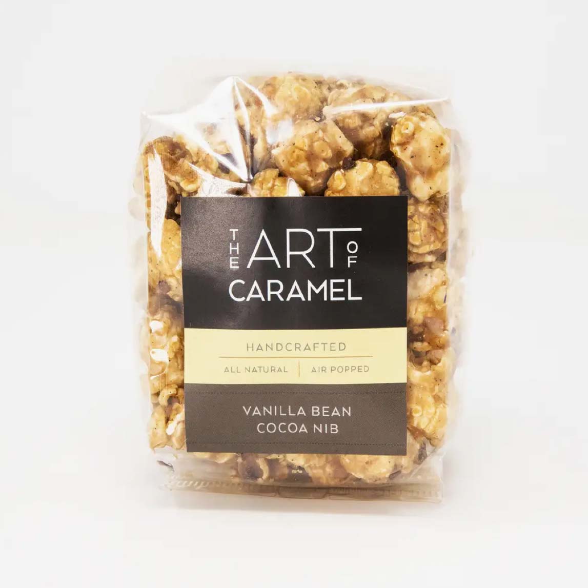 Packaged caramel popcorn with &#39;The Art of Caramel&#39; label on a white background