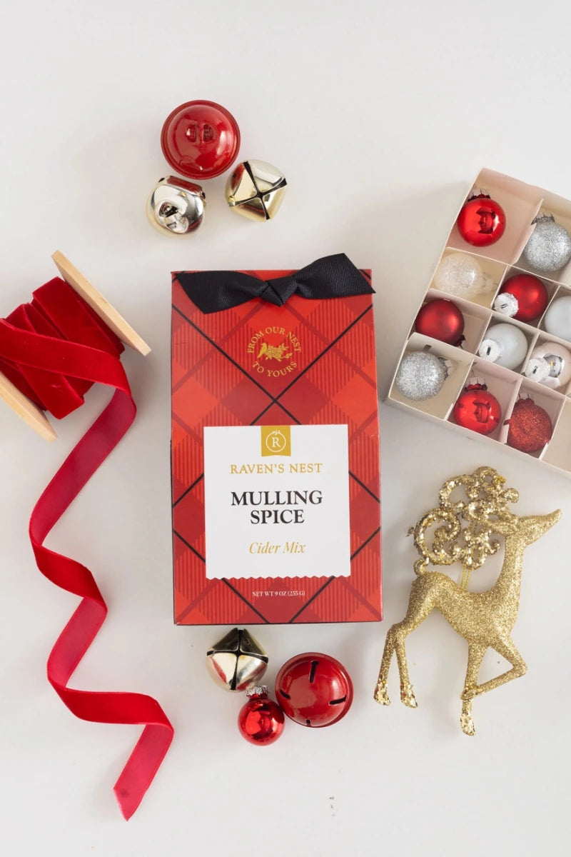 ravens nest mulling spice cider mix with festive accessories around it 