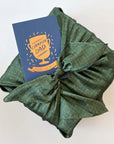 champion dad notecard and green furoshiki fabric wrapped gift box 