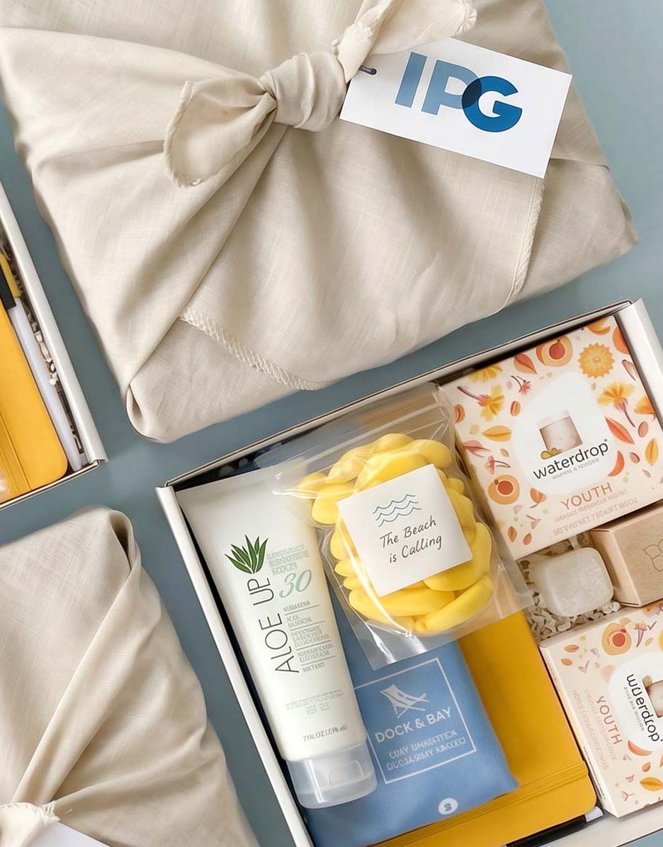 Gift box with summer products and a towel, featuring the IPG brand.