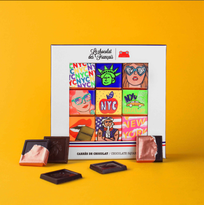 Chocolate packaging with colorful New York-inspired packaging designs on a yellow background