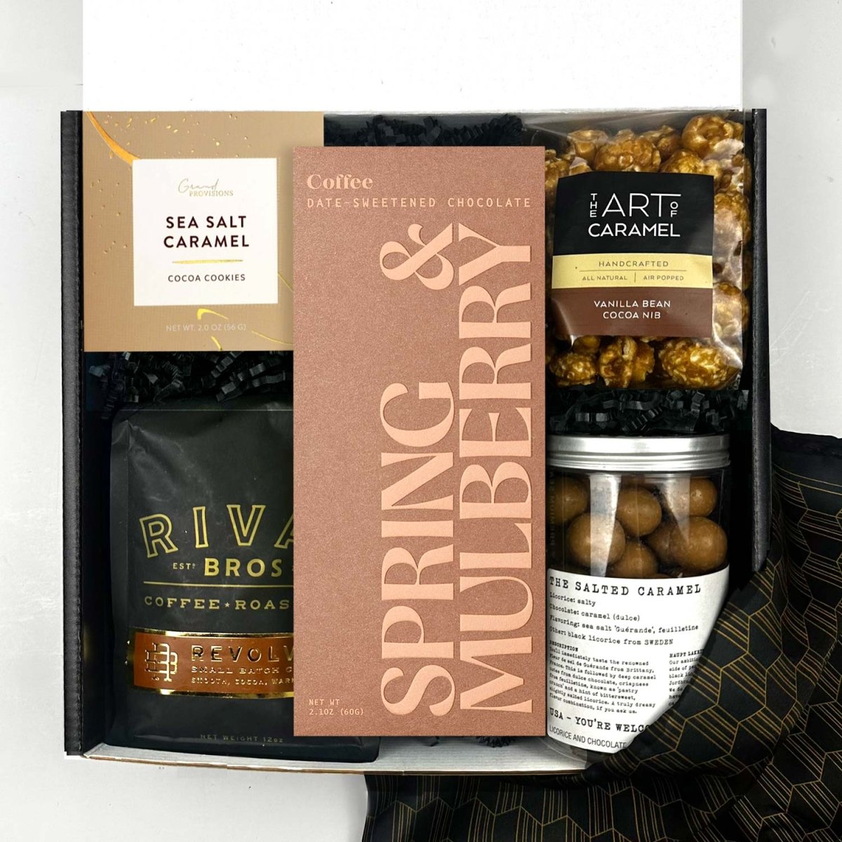 Gift box with Spring & Mulberry chocolate , rival bros coffee, and various snacks and treats.