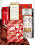 kadoo festive holiday curated gift box filled with jingle bells pops popcorn, whittard luxury white hot chocolate, dandelion chocolate, shortbread, biscuits and more