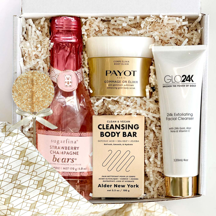 kadoo glowing gold luxurious spa gift box for her. Include body scrub, 24K facial cleanser, sugarfina gummy, body elixir, lollipop & more.