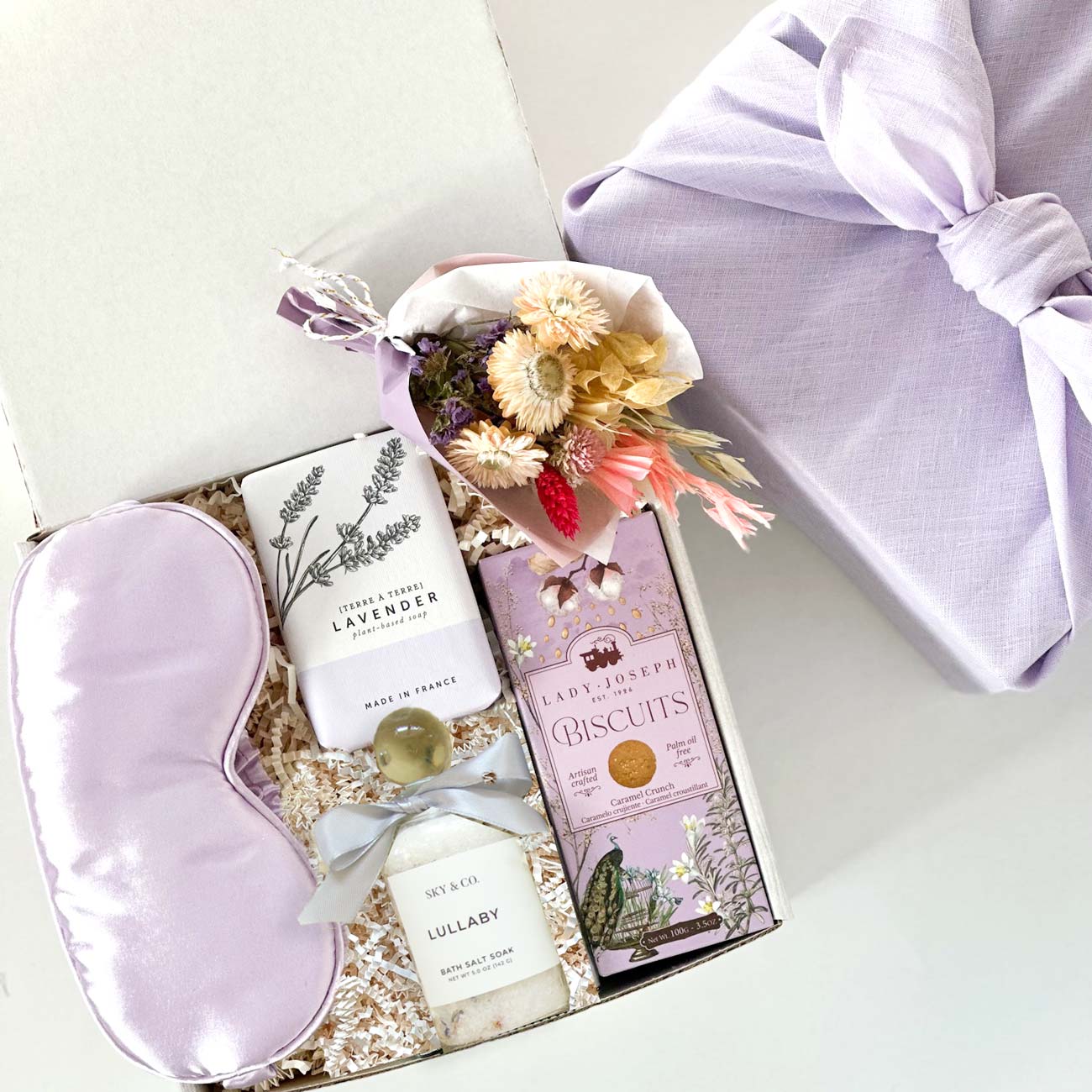 Lavender Spa Curated Gift box: natural bath salt, lavender soap, aromatherapy silk eye mask, biscuits &amp; more.