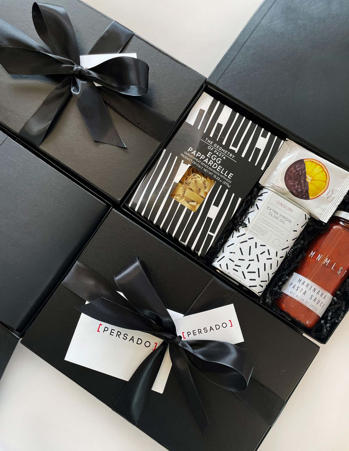 custom corporate gift boxes for persado, including pasta box, olive oil, pasta sauce, crispy chocolate orange slice and more