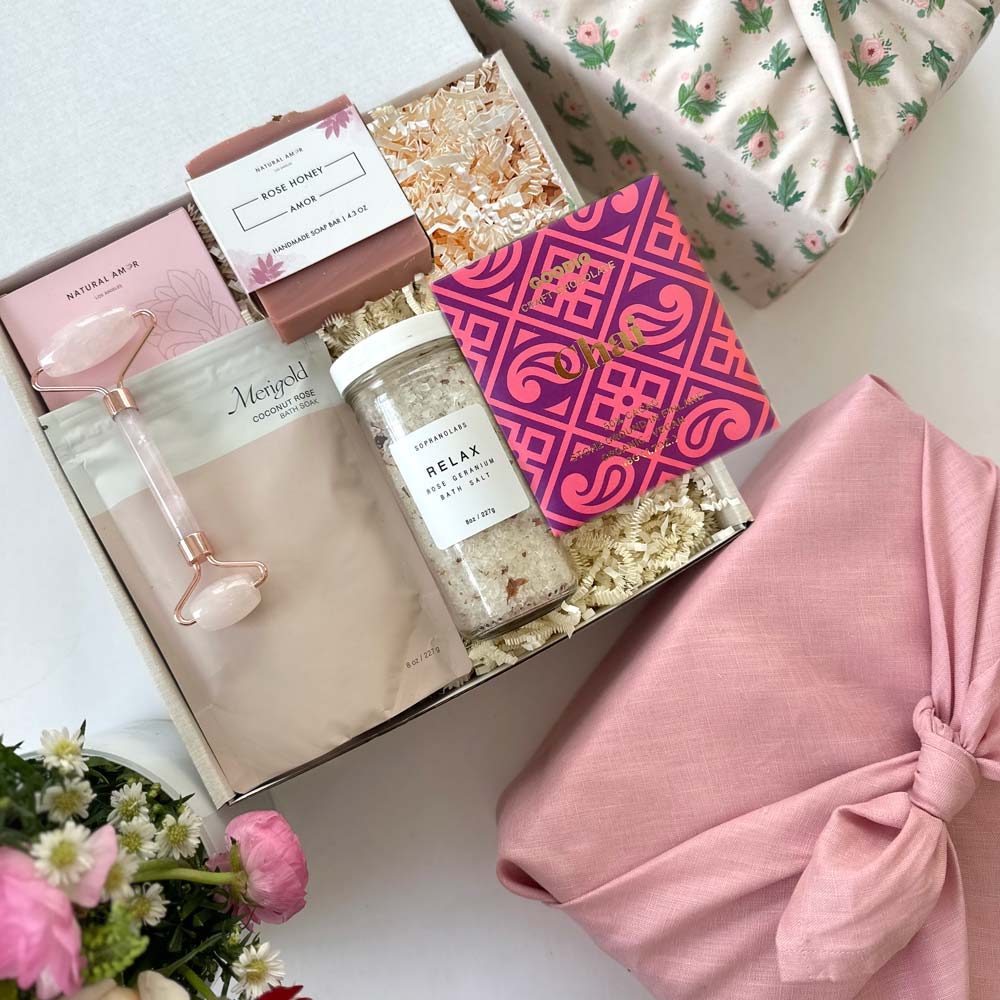 kadoo rose garden gifts. Inside box: bath soak, relax bath salt, farmhouse biscuit, handmade soap, rose quartz facial roller and more. Wrapped in fabric