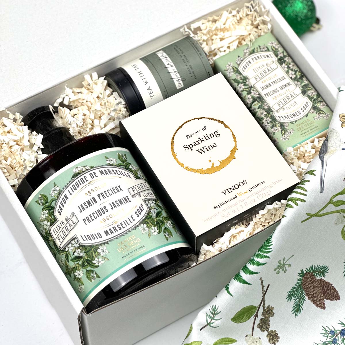 kadoo spa jasmine holiday curated gift box with panier des sens soaps, wine gummy, jasmine tea, and more.