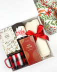 Gift set with Coop's hot fudge peppermint, cocoa mix, mug, and blanket and more in a decorative holiday box.