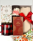 Gift set with Coop's peppermint fudge, mug, blanket, hot cocoa, butter toffee pretzels and more, in a decorative box.