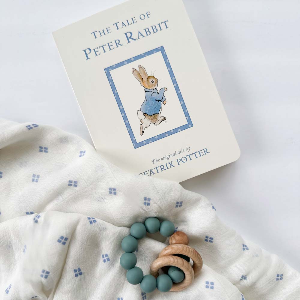 peter rabbit book by beatrix potter, silicone wood blue teether, white swaddle