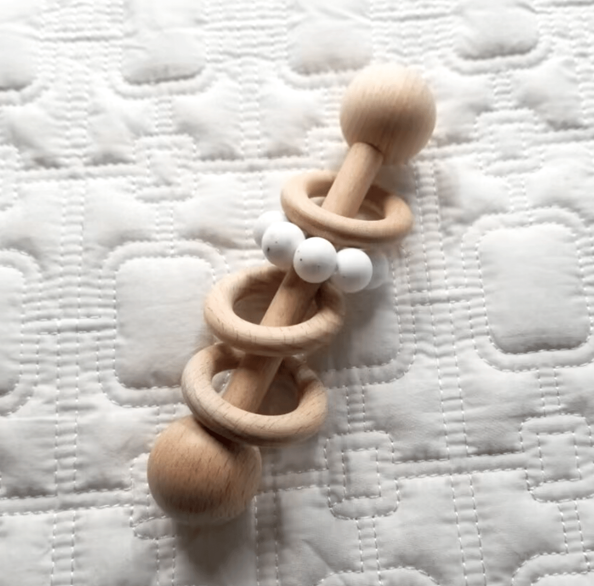 wooden silicone teething ring in birch and white color