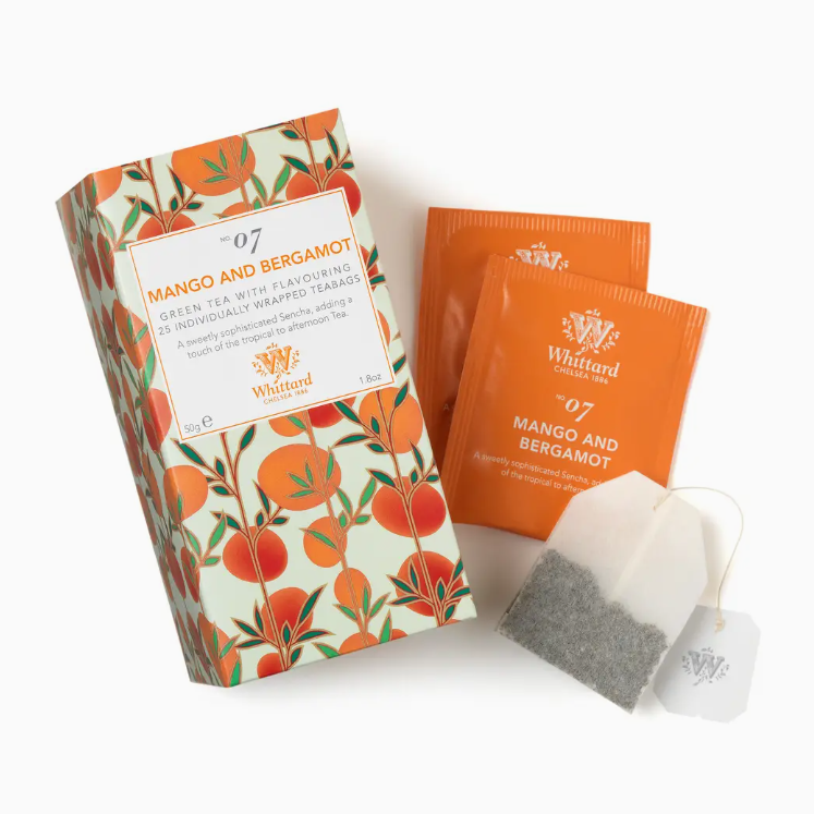 Whittard &amp; Butler Mango and Bergamot tea set, featuring a decorative illustrated tea box, two orange individual tea packets, and one white tea bags on a clean white background.