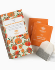 Whittard & Butler Mango and Bergamot tea set, featuring a decorative illustrated tea box, two orange individual tea packets, and one white tea bags on a clean white background.
