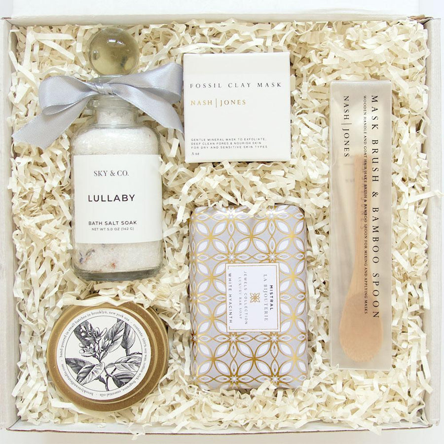 KADOO Rejuvenate Spa Gift for her gift box wrapped in French linen. Contains Sky & Co Bath salt, Nash and Jones clay mask, set of hair brush and wooden spoon , Brooklyn Candle scented candle and Mistral luxury soap.  