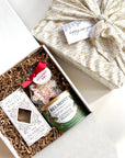kadoo furoshiki corporate curated gift box with gingerbread tiles cookies, candied peanuts and peppermint bark
