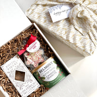 kadoo furoshiki corporate curated gift box with gingerbread tiles cookies, candied peanuts and peppermint bark