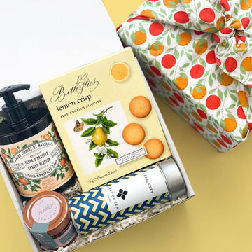 kadoo citrus furoshiki gift box featuring lemon cookies, tea, honey, orange hand soap and more.