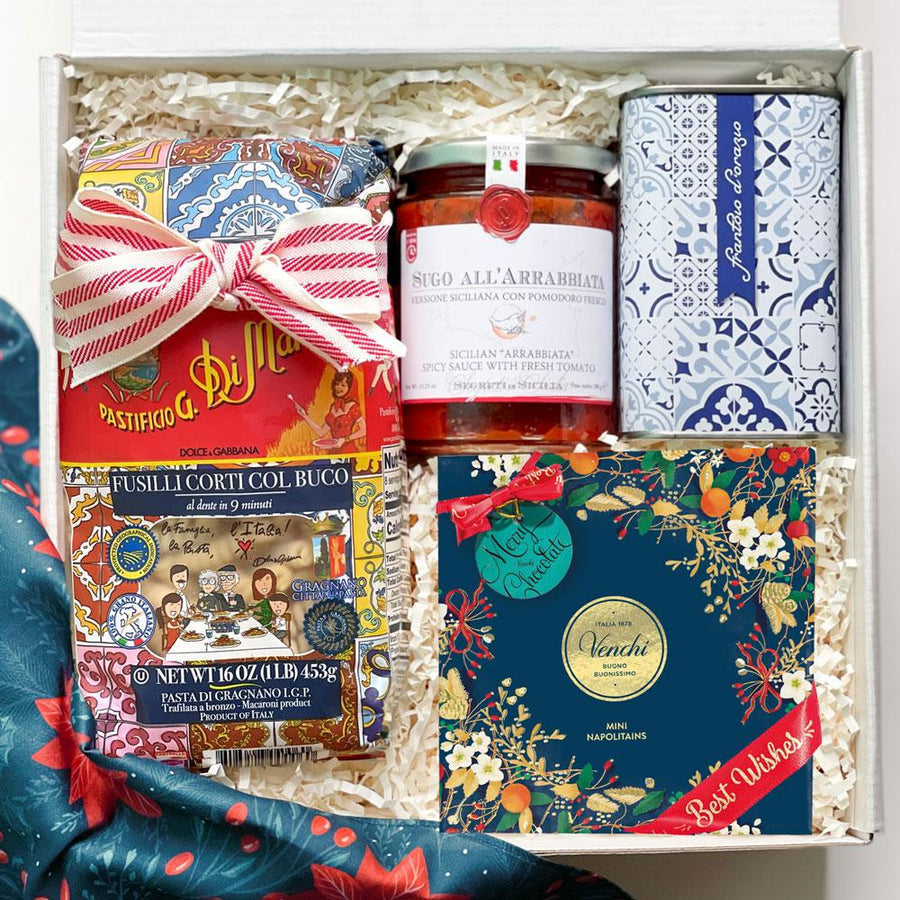 kadoo holiday artisan pasta night gift box. Inside: extra virgin olive oil, fusilli pasta, arrabiata sauce & venchi chocolate