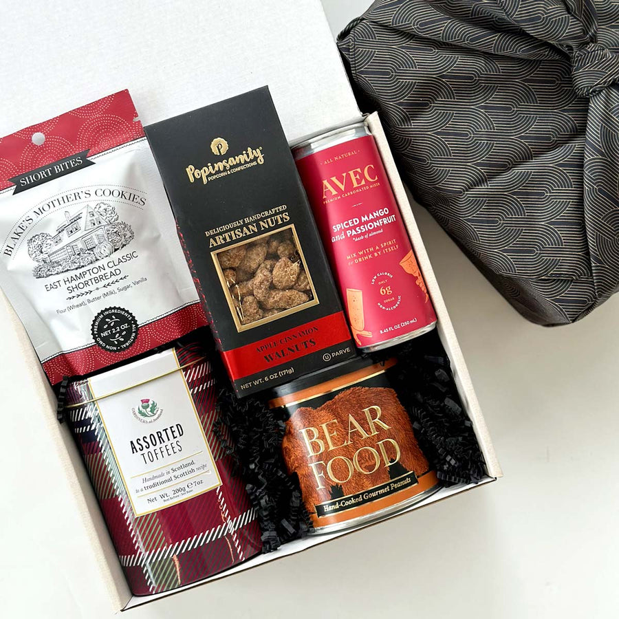 kadoo artisan snack gift box in reusable furoshiki wrap. Include shortbread cookies, assorted toffees, artisan nuts, carbonated drink and more