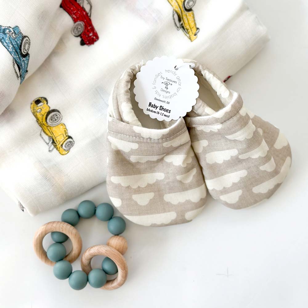 kadoo baby boy shoes, silicone wooden teether ring and swaddle.