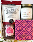kadoo birthday celebration gift box with happy birthday candle, champagne sugar bath treats, chocolate, shortbread & more.