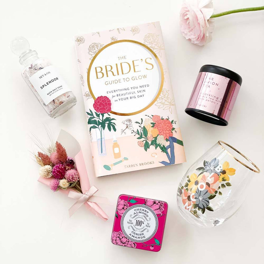 wedding and bridal gifts contain spa and beauty products and the bride's guide to glow book.