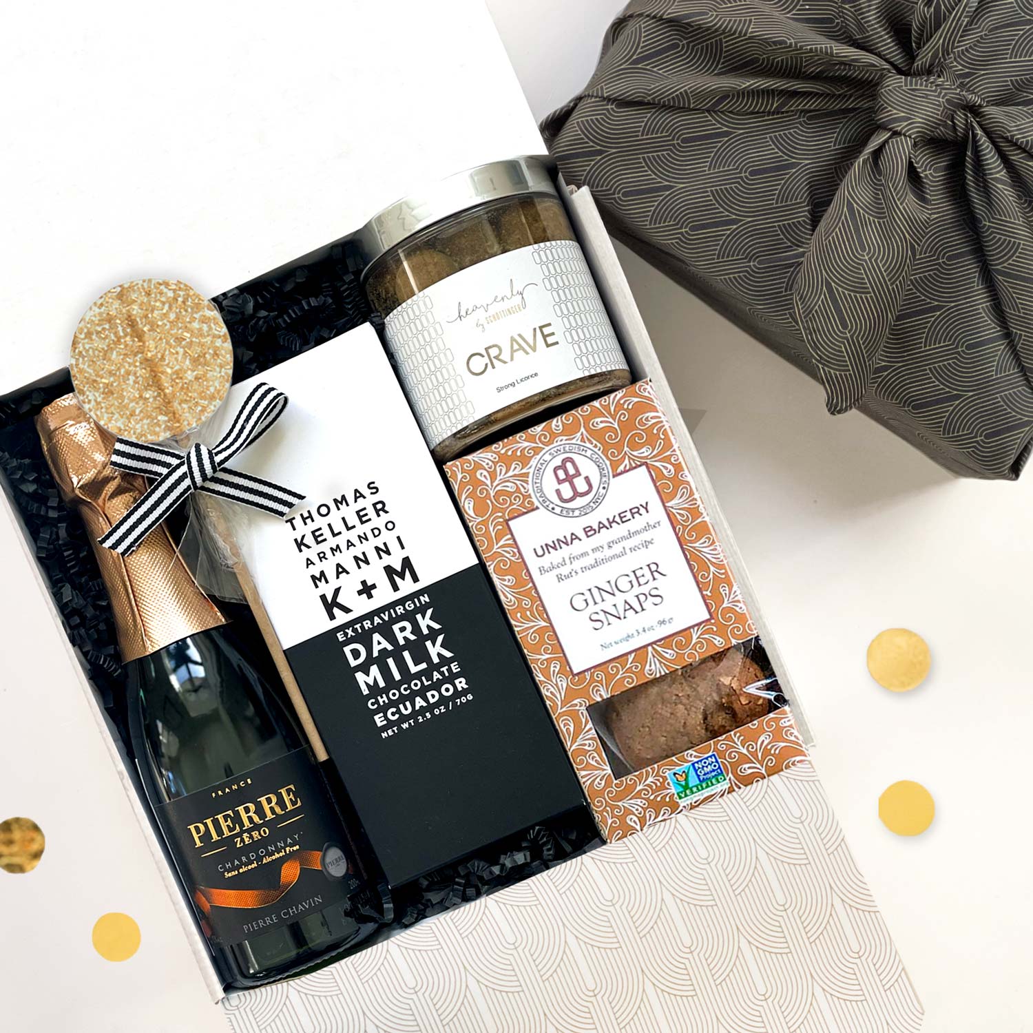 kadoo celebration curated gift box. Included Pierre zero chardonnay, Thomas Keller chocolate, cookies, licorice and more