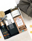 kadoo celebration curated gift box. Included Pierre zero chardonnay, Thomas Keller chocolate, cookies, licorice and more