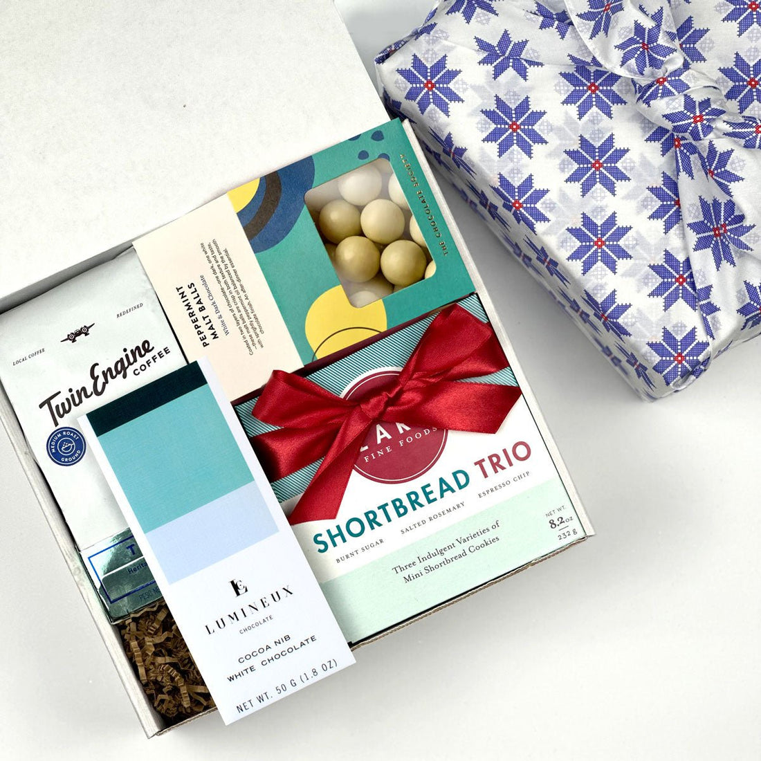 kadoo coffee and chocolate curated holiday gift box. Filled with shortbread cookies, chocolate, premium coffee and more. Wrapped in reusable Furoshiki fabric.