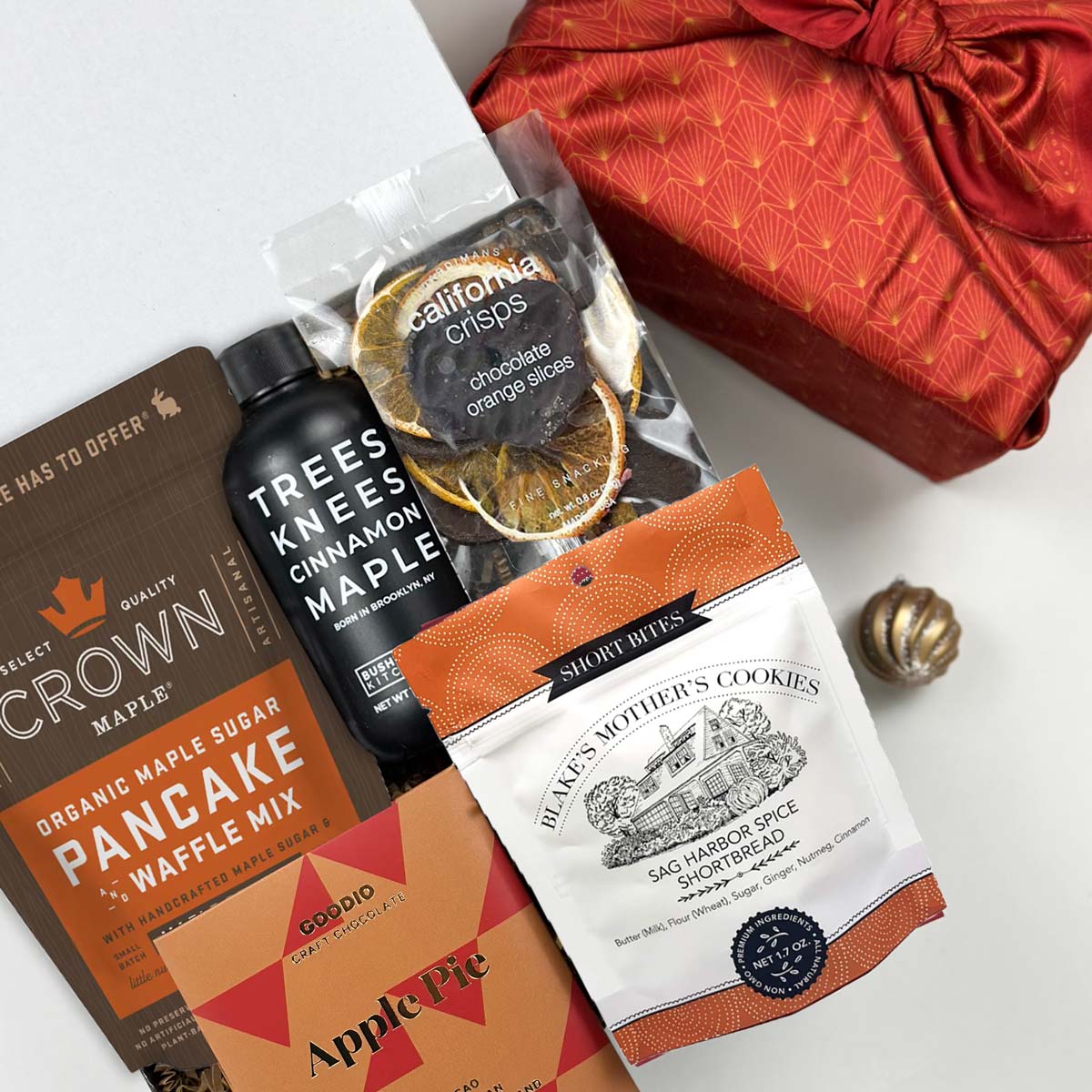 kadoo gourmet pancake holiday gift box wrapped in furoshiki fabric, with pancake &amp; waffle mix, cinnamon maple syrup, apple pie chocolate, cookie and more