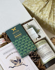 kadoo holiday gift box with tea, cookie, honey, chocolate, candle and more, in reusable furoshiki fabric wrap