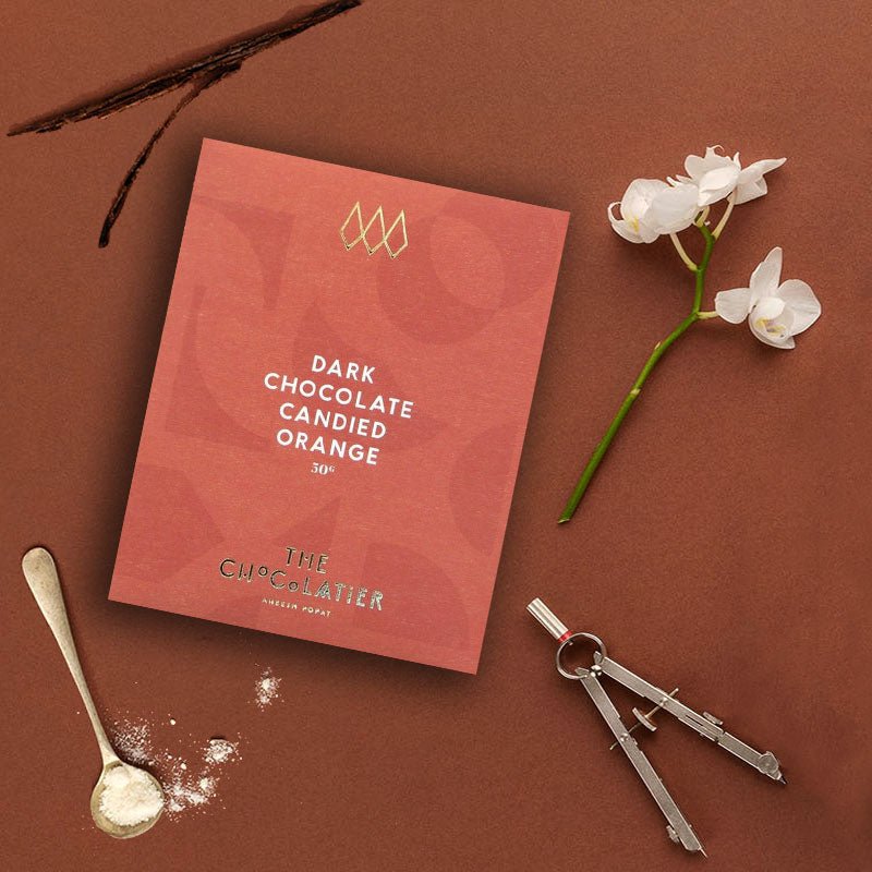 the chocolatier candied orange 70% dark chocolate bar.